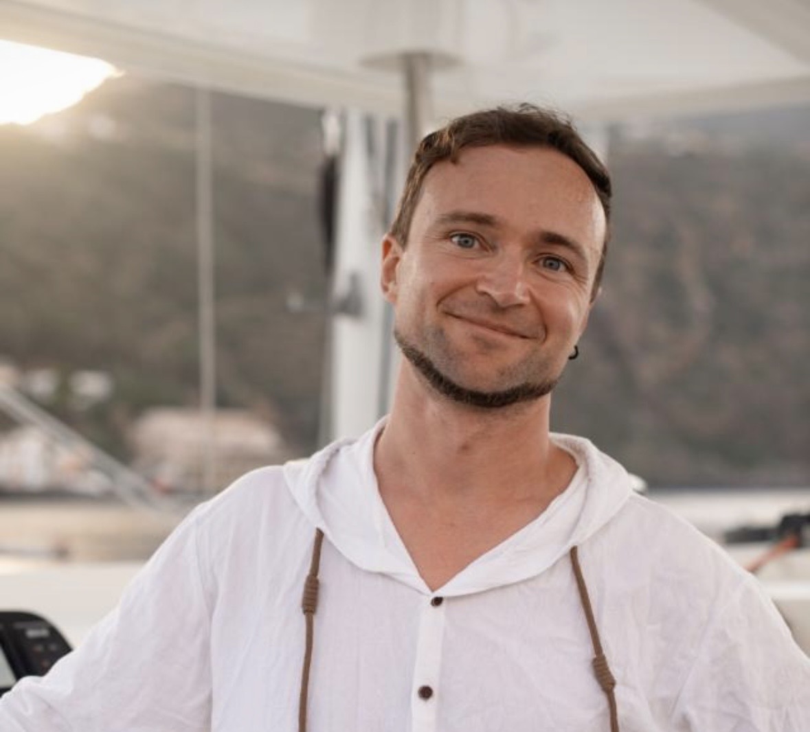 Portrait of Sergy smiling on a yacht at anchor