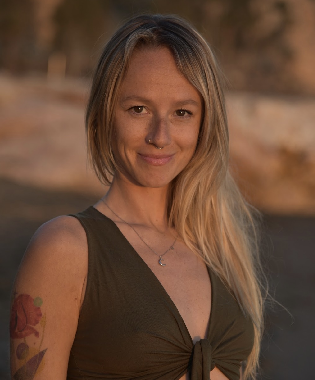 Portrait of Ania Krol smiling in warm golden light